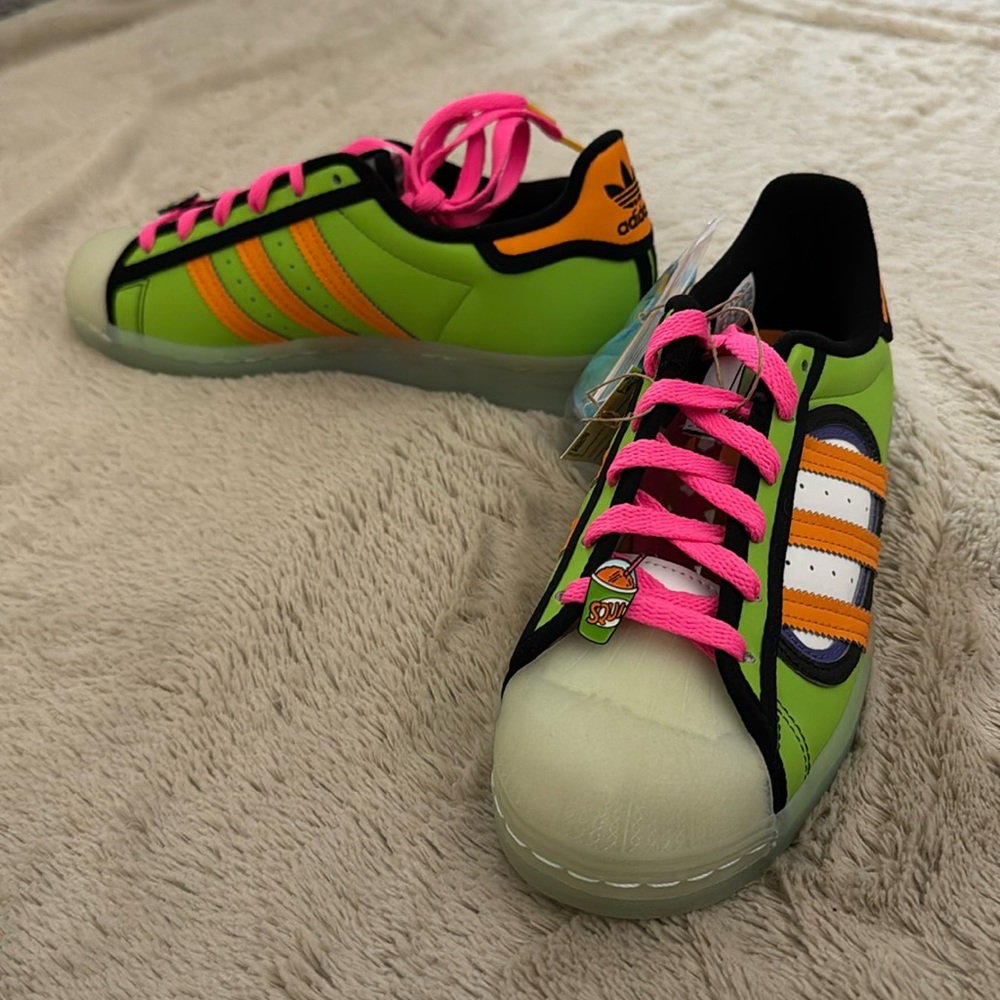 Adidas x The Simpsons shoes. The Simpsons Squishee. Superstar Simpsons.